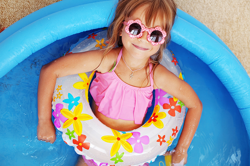little girl relaxing in the pool